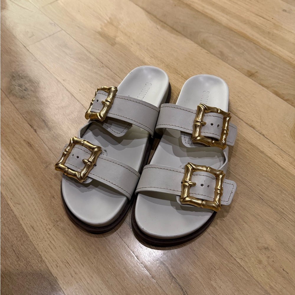 SCHUTZ Enola Cream Double-Buckle Slide Sandals with Gold Buckles